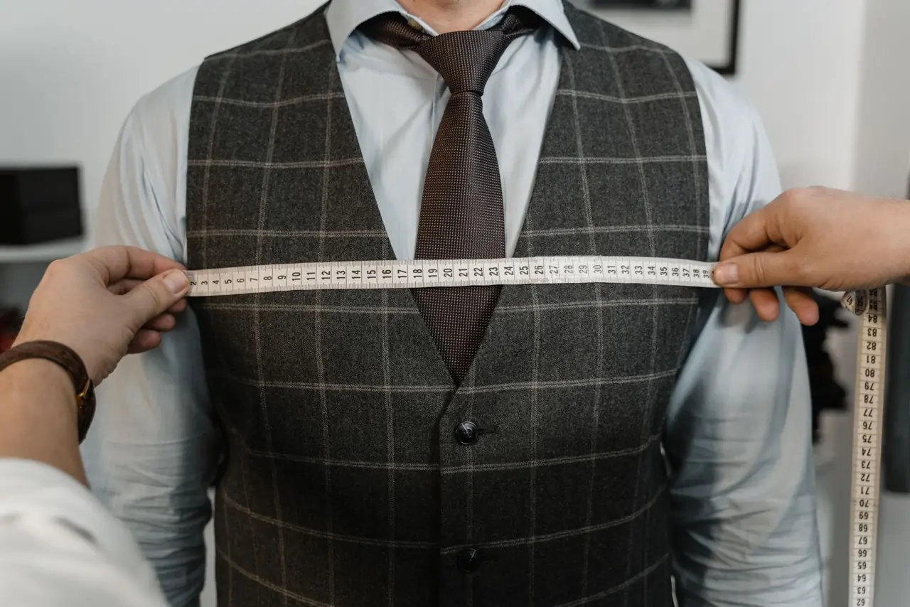 Measuring tape across a tailored waistcoat